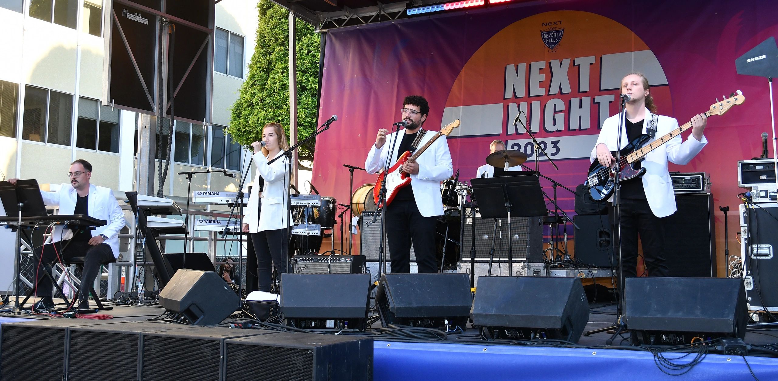 Solomon Margo performing onstage with The Tokens
